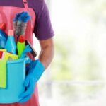 Elevate Your Operations with Professional Commercial Cleaning in Oakland 4 commercial cleaner holding a bucket of cleaning products