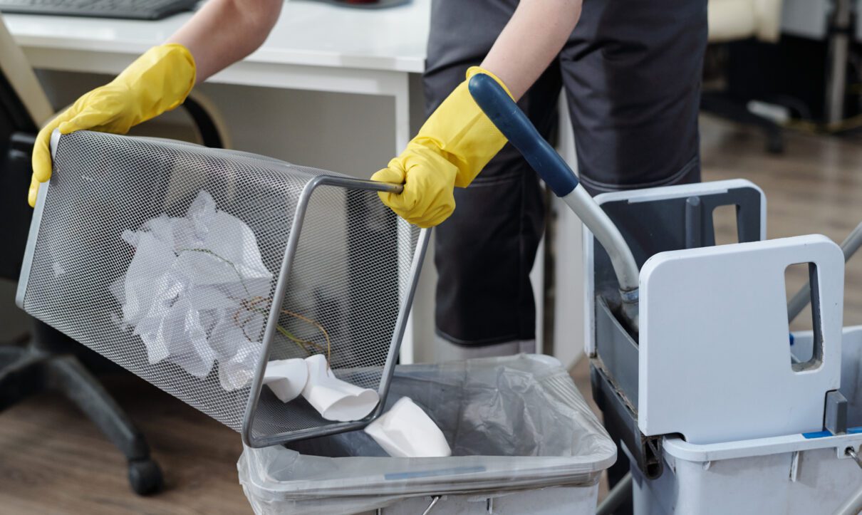 Hayward Cleaning Services: Transforming Your Space, One Clean at a Time 1 Office cleaning emptying waste bin