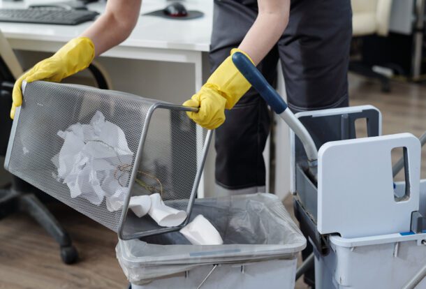 Office cleaning emptying waste bin